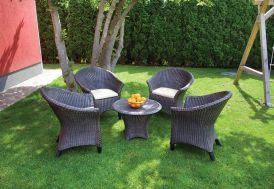 salon de jardin en résine tressée marron 4 fauteuils et 1 table